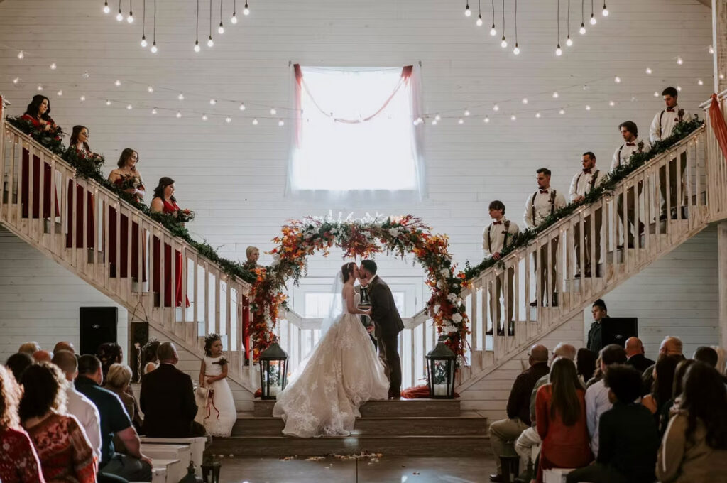 Wedding at Arkansas wedding barn with bridal party up the stairs